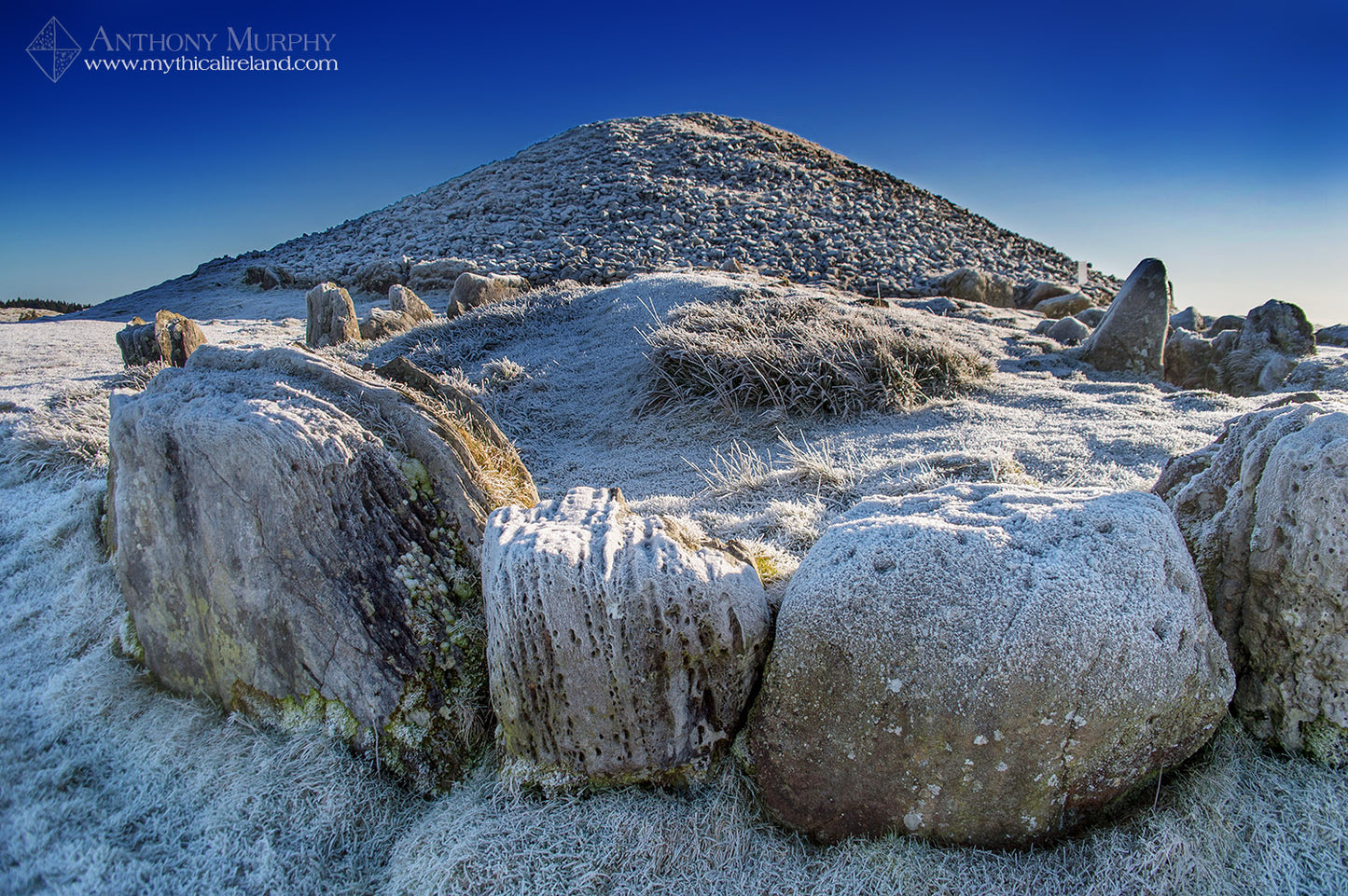 Cairn S (foreground) and Cairn T (The Hag's Cairn) at Slieve na Calliagh, Loughcrew, County Meath, covered in ice after a night of hard winter frost. 