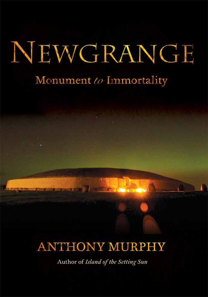 Image of the front cover of a book called Newgrange: Monument to Immortality. It shows a photograph of the Newgrange monument lit up at night, surrounded by the Nothern lights. 