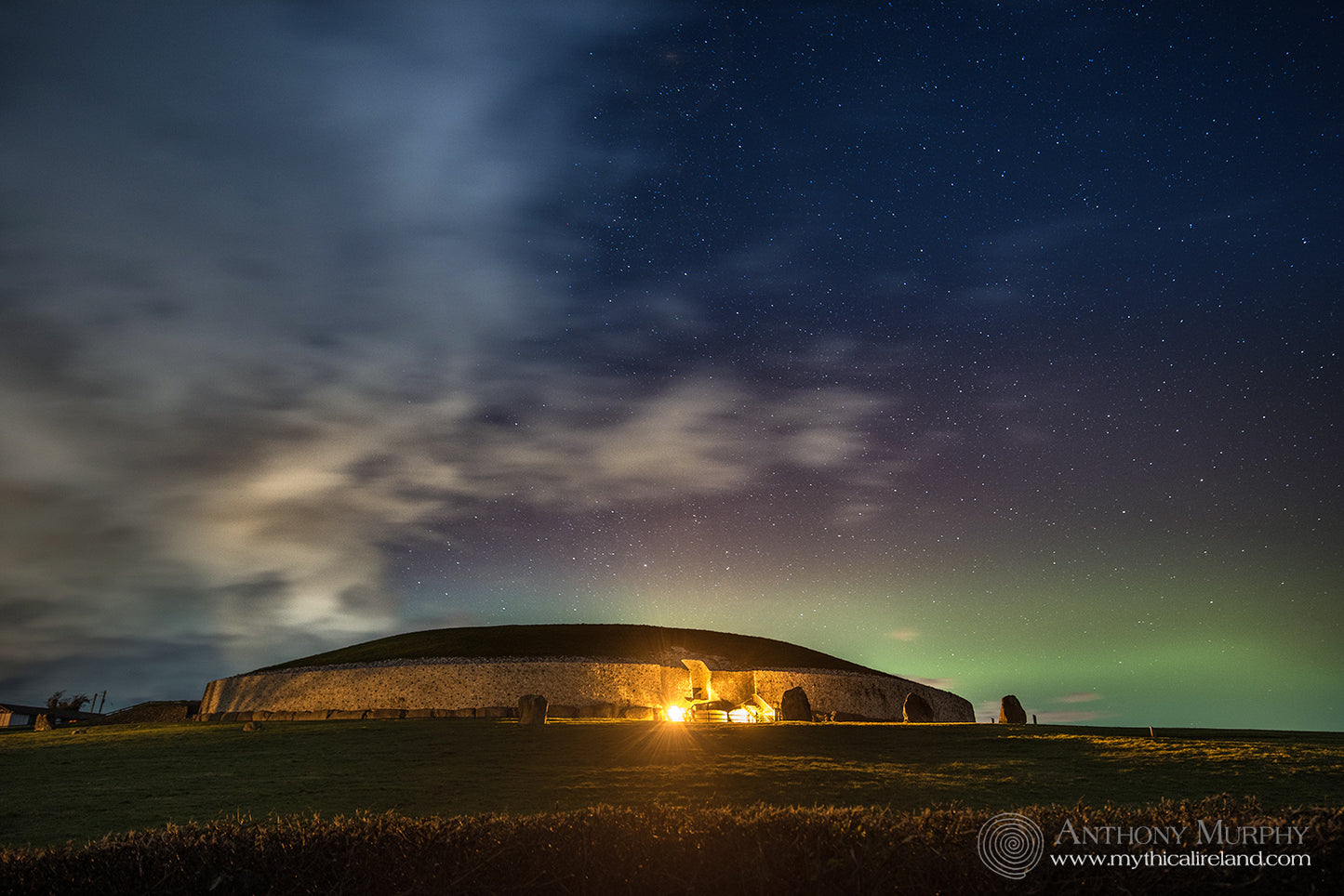 Green northern lights over Newgrange