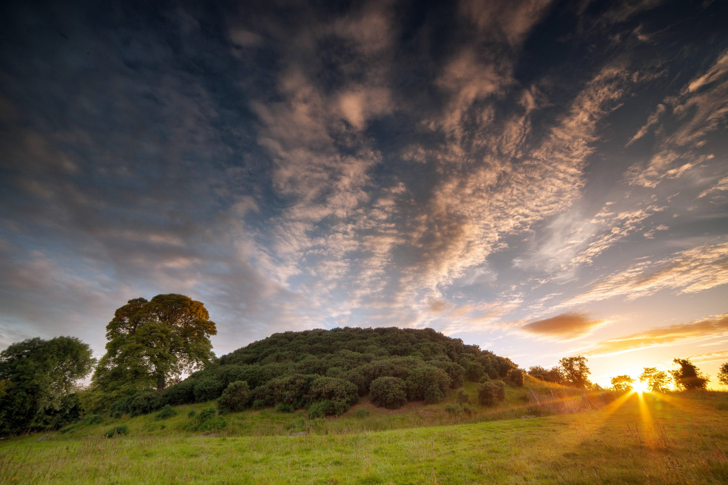 Sunset at Dowth at summer solstice, the longest day of the year.