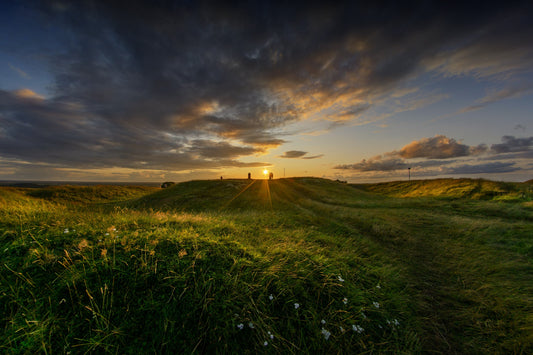 People on top of An Forradh - the Royal Seat - watching the sun going down on the Hill of Tara. The light was magical.