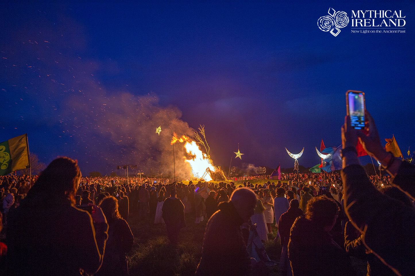 The crowd celebrates the lighting of the Uisneach Bealtaine Fire 2024