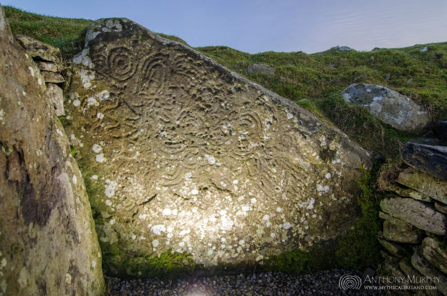 Megalithic art on one Megalithic art on one of the chamber stones of Cairn U. Cairn U lost its roofing stones at some time in recent centuries, and was once an enclosed space, a tomb like those of Cairn T and Cairn L, and Newgrange and Knowth and Dowth. 