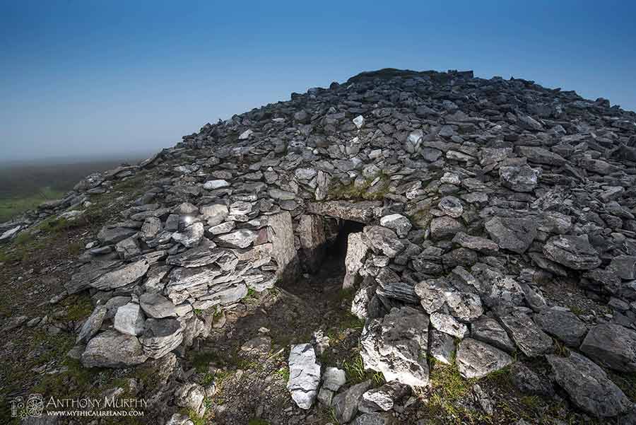 The exterior of Cairn K, one of the cairns of the Carrowkeel complex on the Bricklieve Mountains, County Sligo, Ireland. The cairns are situated on the limestone hilltops of Bricklieve, and on a clear day there are breathtaking views across the ancient landscapes of counties Sligo, Roscommon and Leitrim. Cairn K is a Neolithic passage-tomb dating to around five and a half thousand years ago. The early farmers of Ireland built them here in the remote past as places to bury and honour their dead.