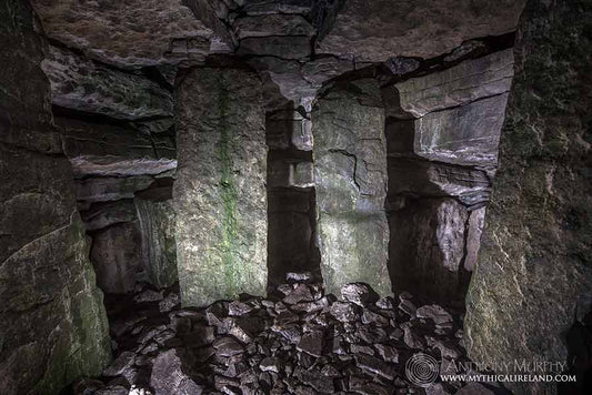 A view of the chamber of Cairn G, Carrowkeel, Co. Sligo, looking from the junction of the passage and chamber towards the rear compartment.