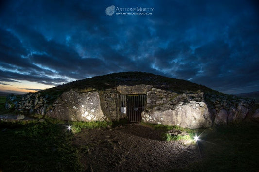 Cairn T (The Hag's Cairn) at Loughcrew with its entrance illuminated at twilight at Samhain. Cairn T is the largest cairn at Slieve na Calliagh, Loughcrew, Co. Meath. It is famed for its alignment towards the rising sun on the sping and autumn equinoxes.