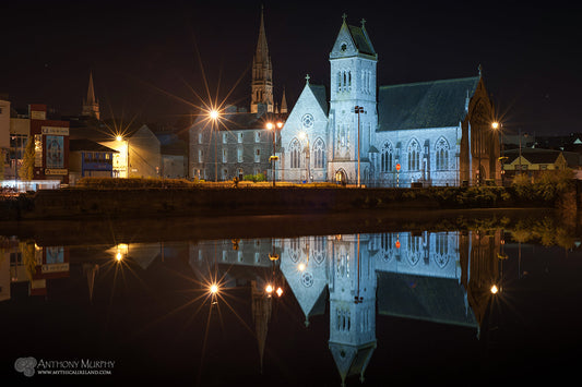 Three churches – the Dominican Church, St. Peter's Parish Church and St. Peter's Church of Ireland, are reflected in a flat River Boyne.