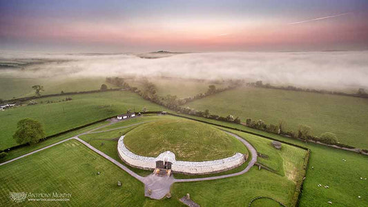A bank of fog approaches Newgrange (Síd in Broga) at dusk. This evocative image was taken with my drone minutes after the sun had set. Because Newgrange is on top of a ridge, it sometimes sits above the approaching mist and fog.