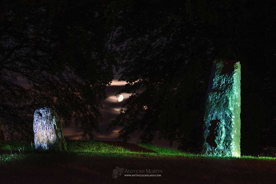 Blocc and Bluicne, the magical standing stones of Tara, with the evening Lughnasa moon. These two stones, located in St. Patrick's Churchyard on the Hill of Tara, were said in mythology to part wide enough to allow a chariot through if the chariot was driven by the man who would become the High King. The taller stone has a figurine engraved in relief on its eastern face, said to be a Sheela-na-gig.