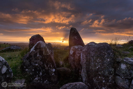 Lughnasa sunset shines into the passage of Cairn S, Loughcrew