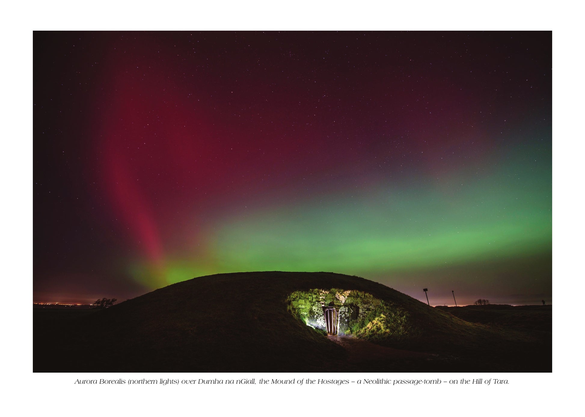 Aurora borealis over Dumha na nGiall on the Hill of Tara