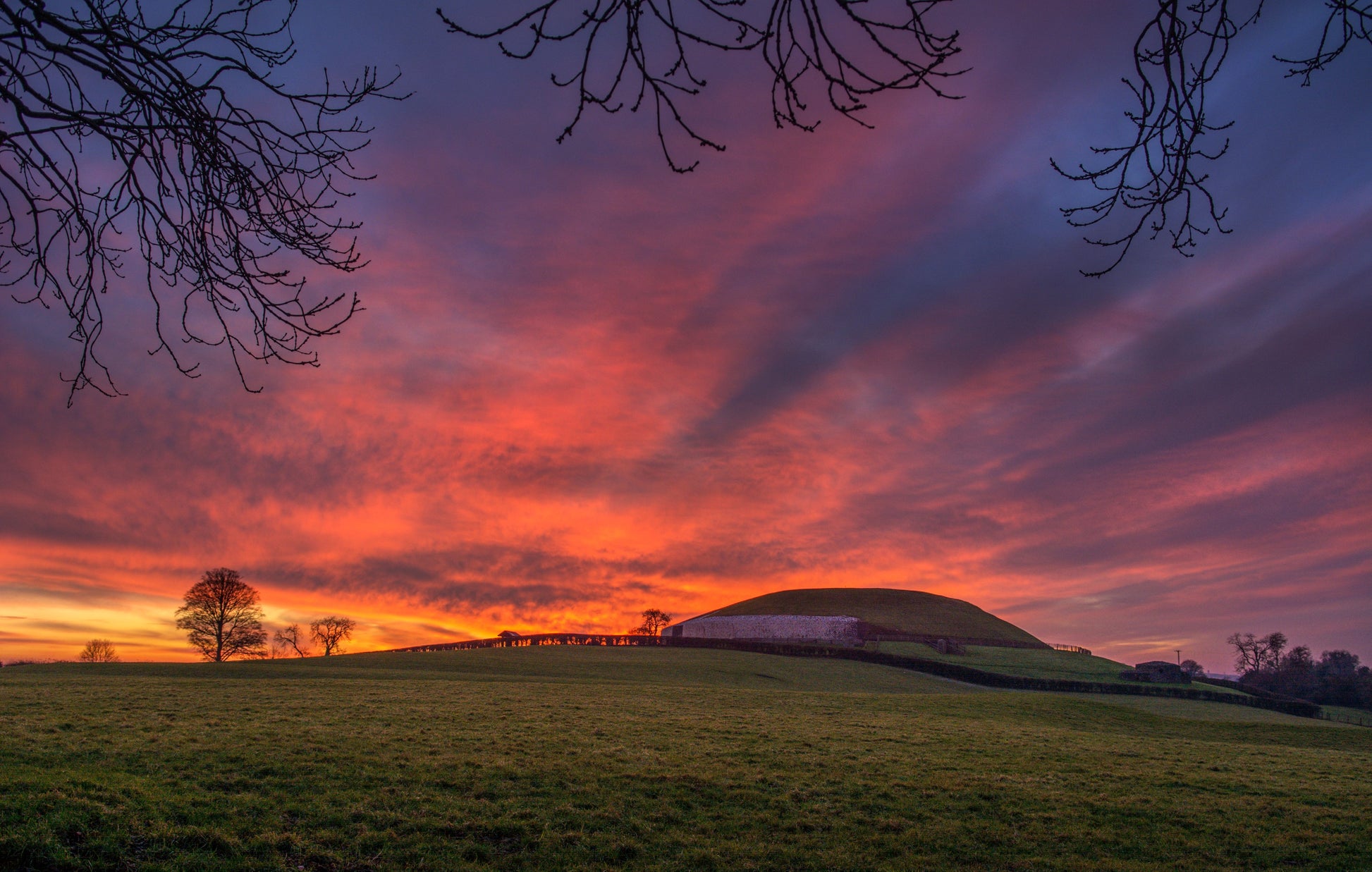 Newgrange Ireland Under a Flame Red Sunset