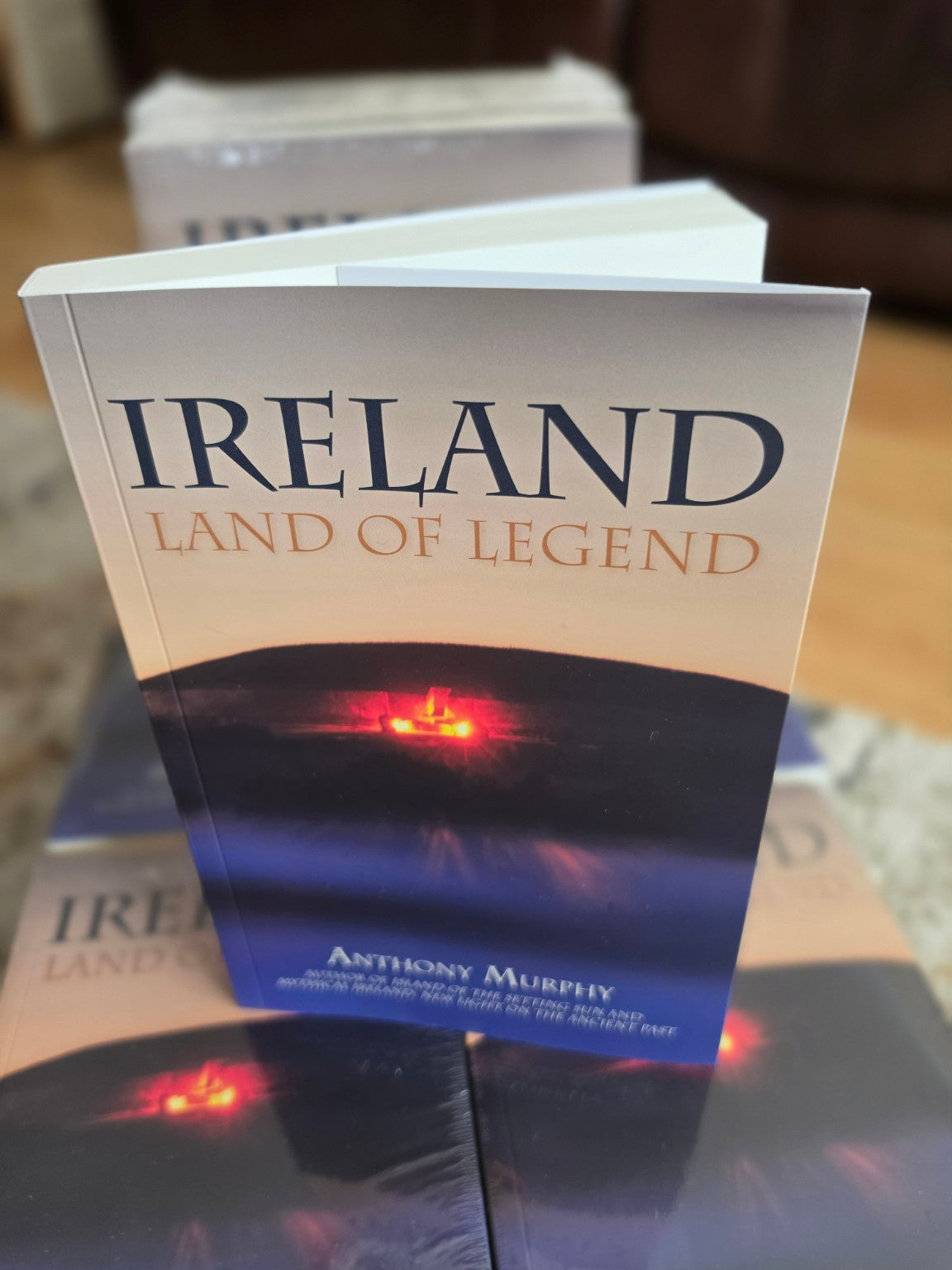 Angled photograph of the finished Ireland: Land of Legend paperback showing its pages and thickness