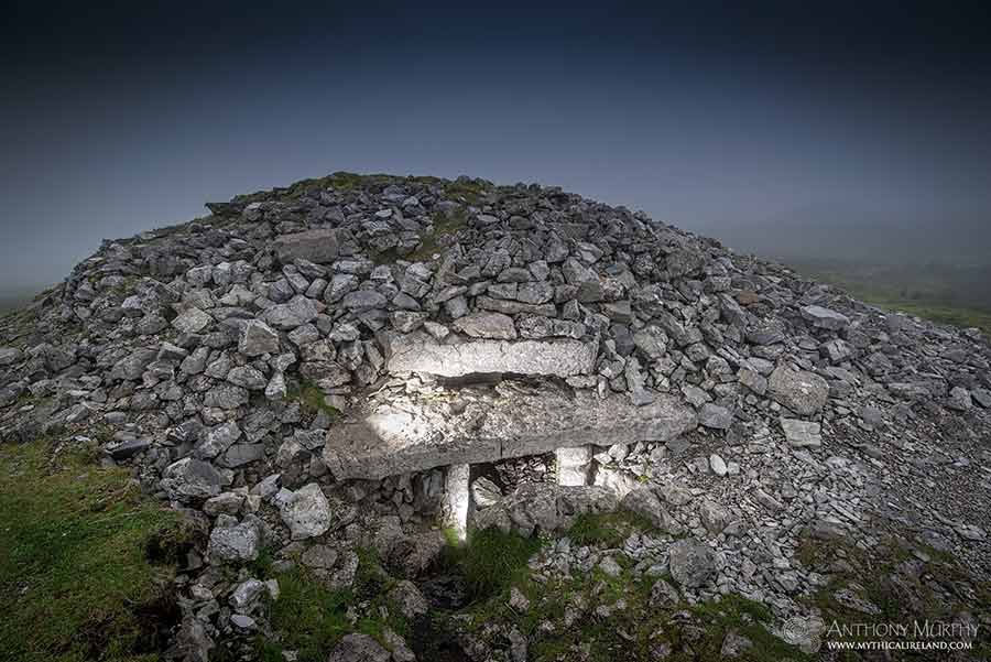 Cairn G, one of a complex of Neolithic chambered cairns at Carrowkeel, on the Bricklieve Mountains, County Sligo, pictured in the early morning fog. Cairn G is the only known passage-tomb in Ireland, apart from Newgrange, to have a roof box above its entrance. This photo was taken on an autumn morning which was full of atmosphere. My climb to the cairns was completely shrouded in dense fog, so I could barely see 10 metres in front of me. However, my efforts were rewarded with this very atmospheric image.