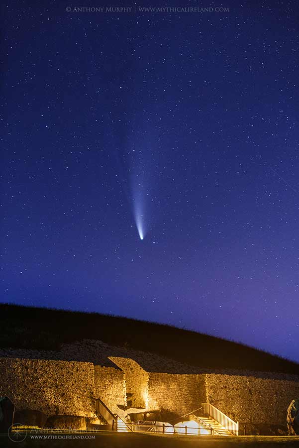 Two-tailed comet NEOWISE over Newgrange entrance