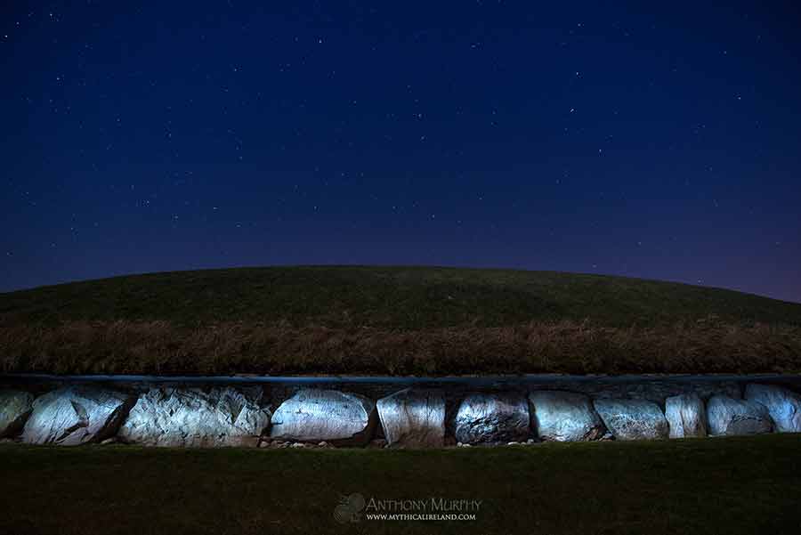 Knowth kerb stones lit at night