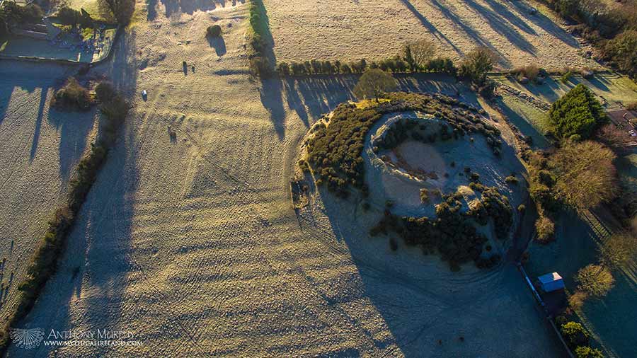 A frost covered Dowth monument from the air during winter.