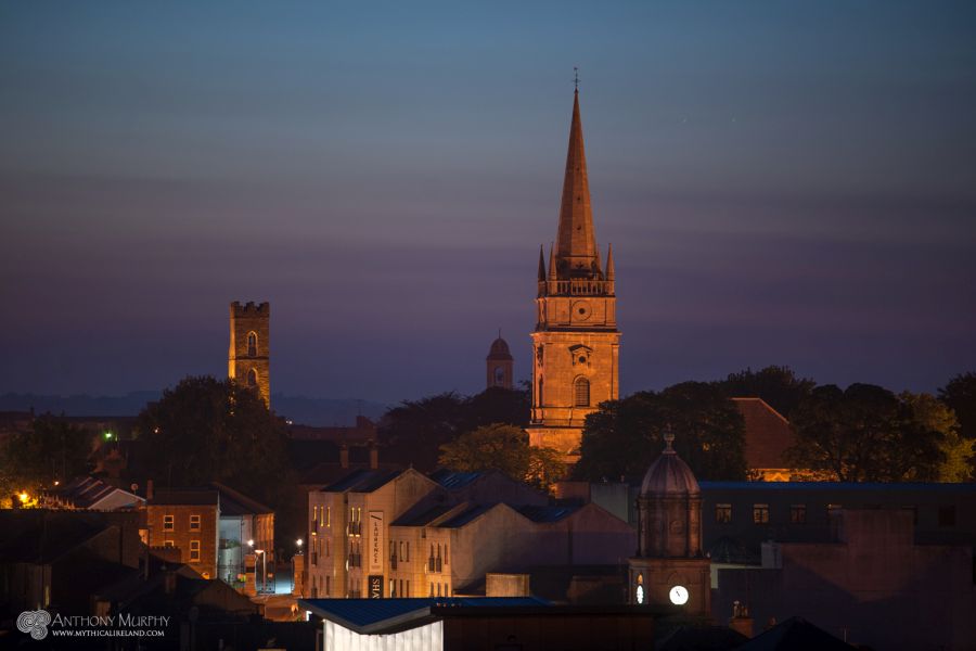 Magdalene Tower, Our Lady of Lourdes Church, St. Peter's Church of Ireland and the Tholsel at twilight, pictured from Millmount.